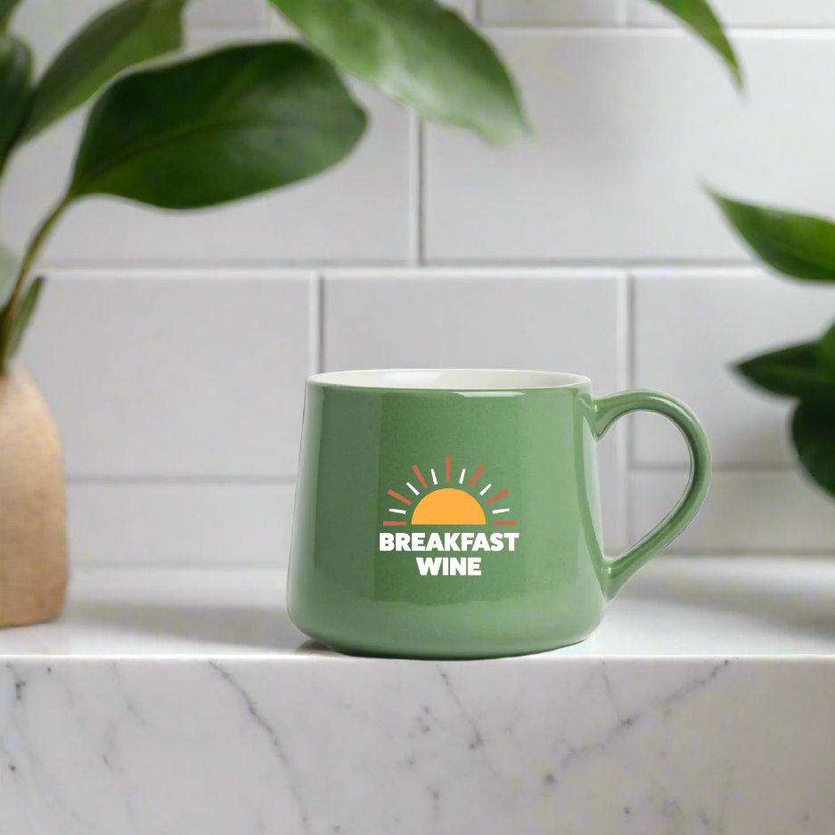 green mug on kitchen countertop